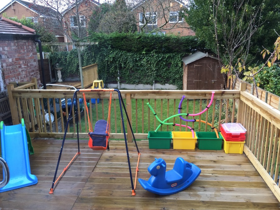 The secure gated garden and decking area at Timperley Tots