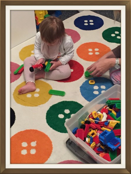 Ada pointing out shapes during a learning activity